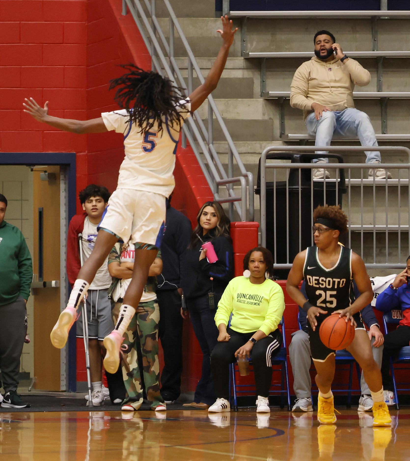 Duncanville guard Bugg Edwards (5) skies defensively in the face of DeSoto guard Shelton...