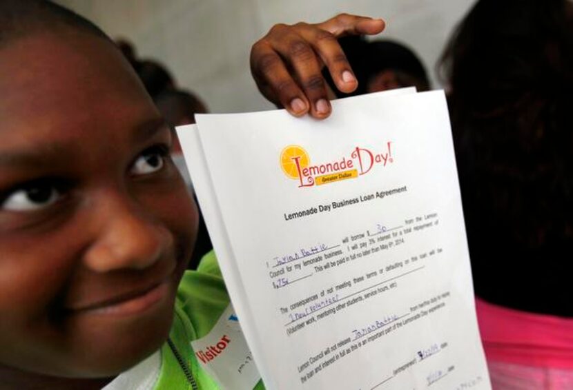 
Jaylan Battie, 10, showed off his Lemonade Day loan agreement with PlainsCapital Bank.
