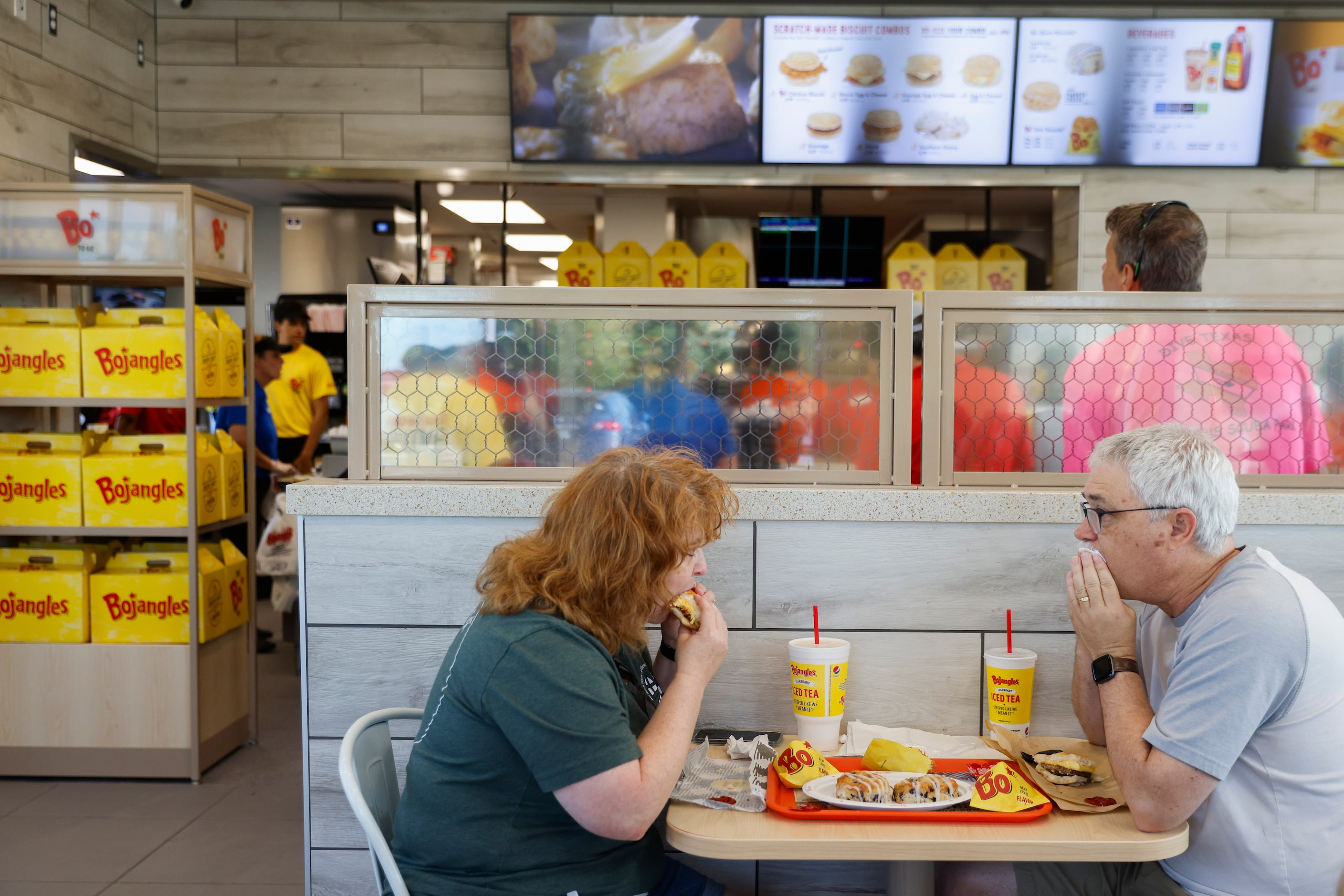 Tina Rosenbaum (left) of Arlington eats a meal with Corey during the opening day of...