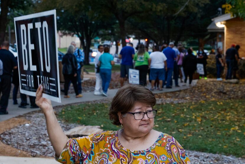 Gina Galvagni, a volunteer for Beto O'Rourke's campaign for governor, stands outside the...