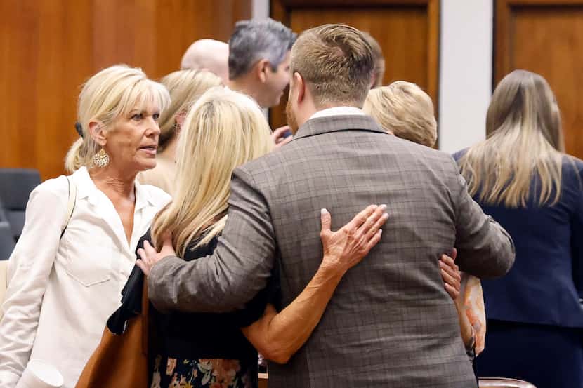Attorney Paul Wingo hugged Betty Thomas’ daughters, Cheryl Goff (from left), Charlotte...