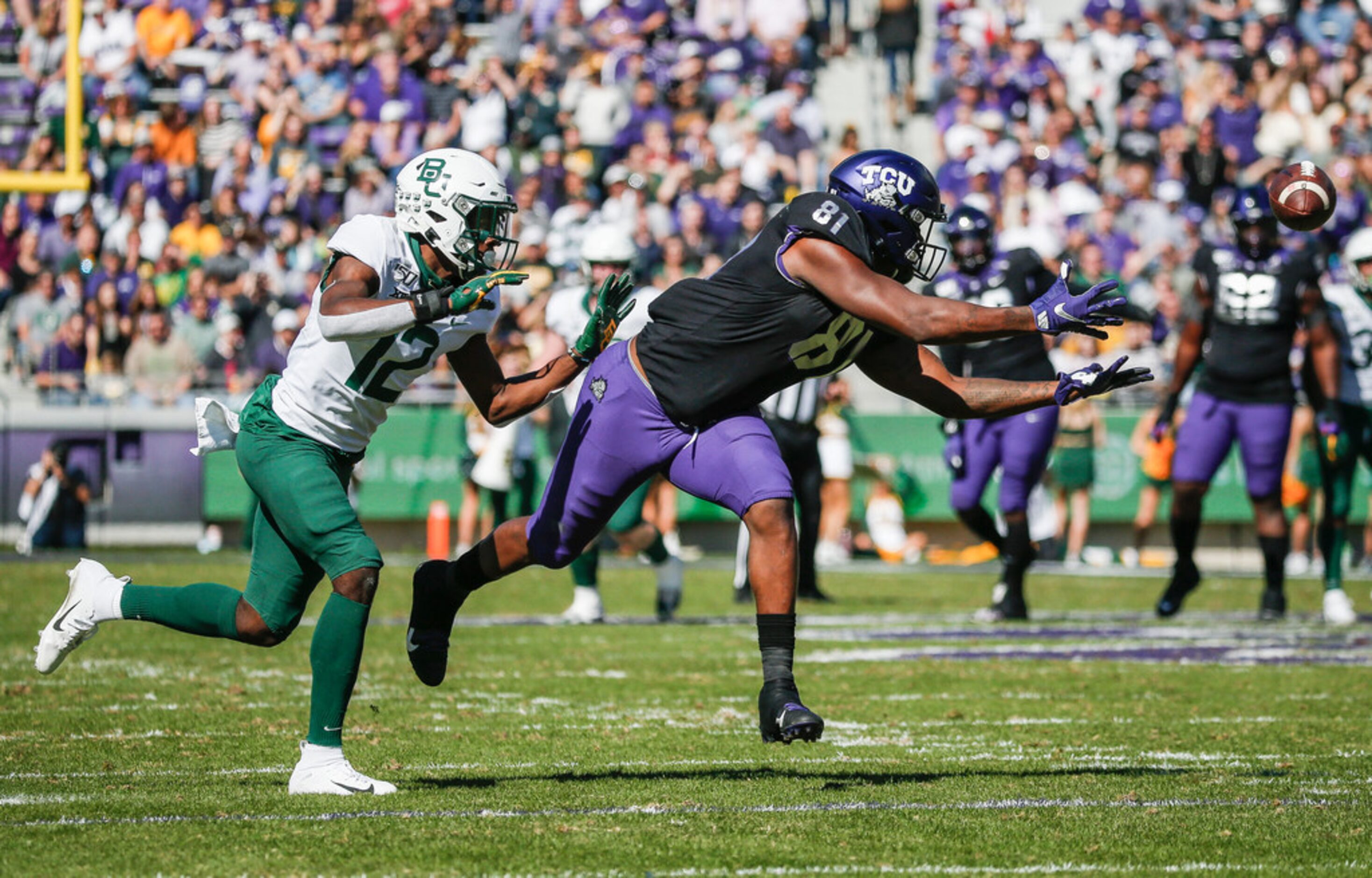 TCU Horned Frogs tight end Pro Wells (81) receives a pass as Baylor Bears cornerback Kalon...