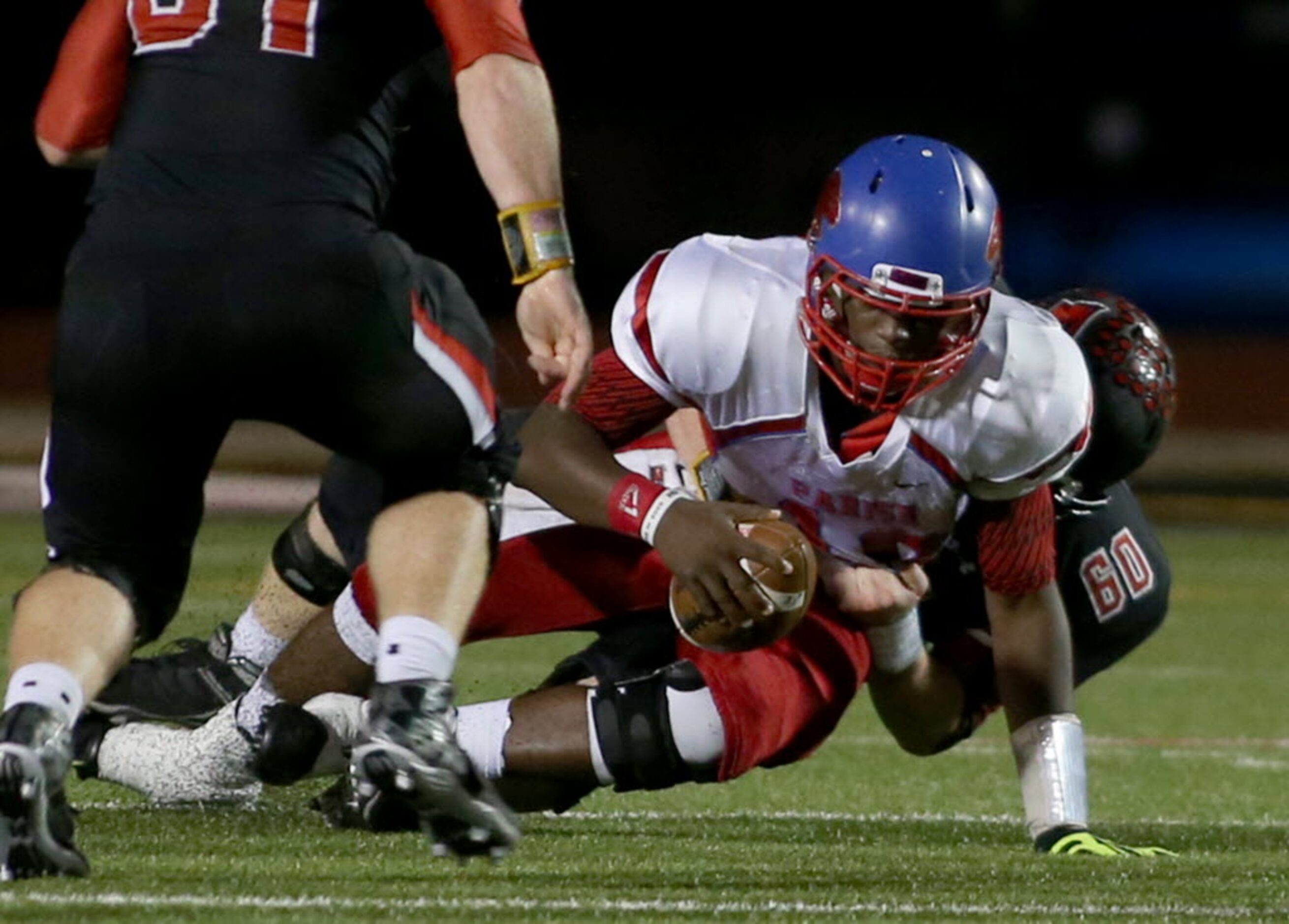 Parish Episcopal’s Jeremy Hodge (10) is sacked by Fort Worth Christian’s Thomas Mitchell...