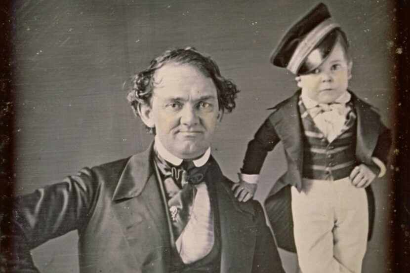 In this 1850 photograph, P.T. Barnum poses with his international star "General" Tom Thumb,...