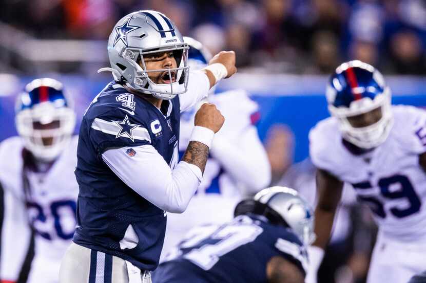 FILE - Cowboys quarterback Dak Prescott (4) shouts a play during the fourth quarter of a...