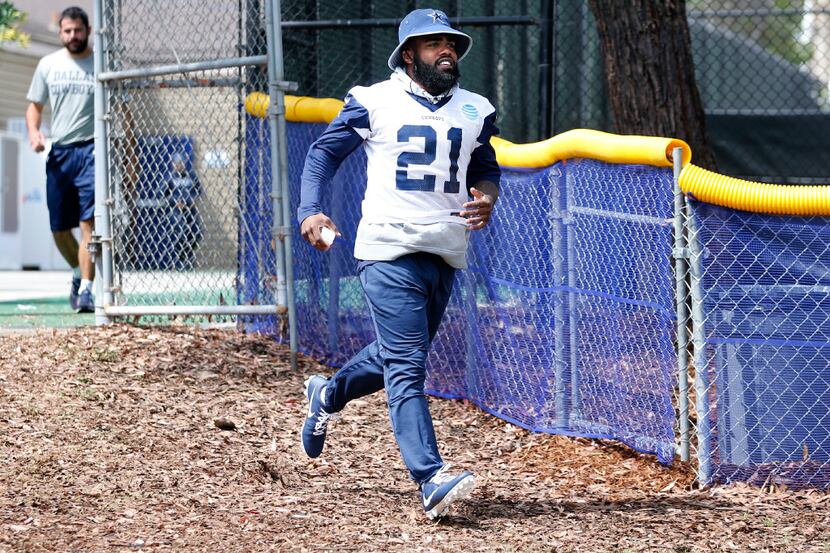 Dallas Cowboys running back Ezekiel Elliott (21) make his way onto the field for the morning...