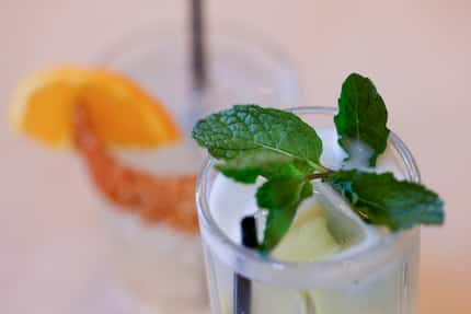 Arak Mojito (front), is made with Israeli arak, which has a licorice taste. Muddled with...