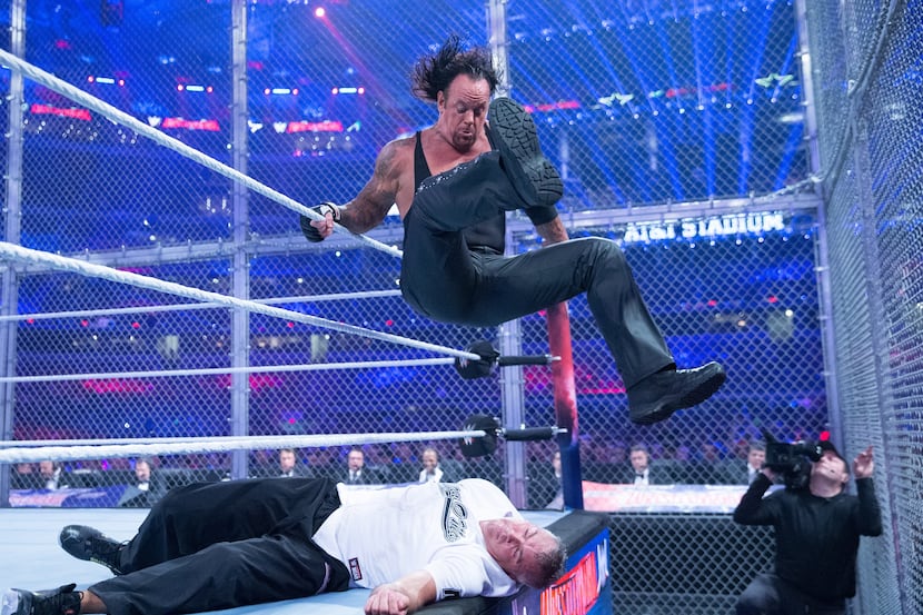 WWE legend The Undertaker wrestles Shane McMahon inside Hell in a Cell at WrestleMania 32 at...