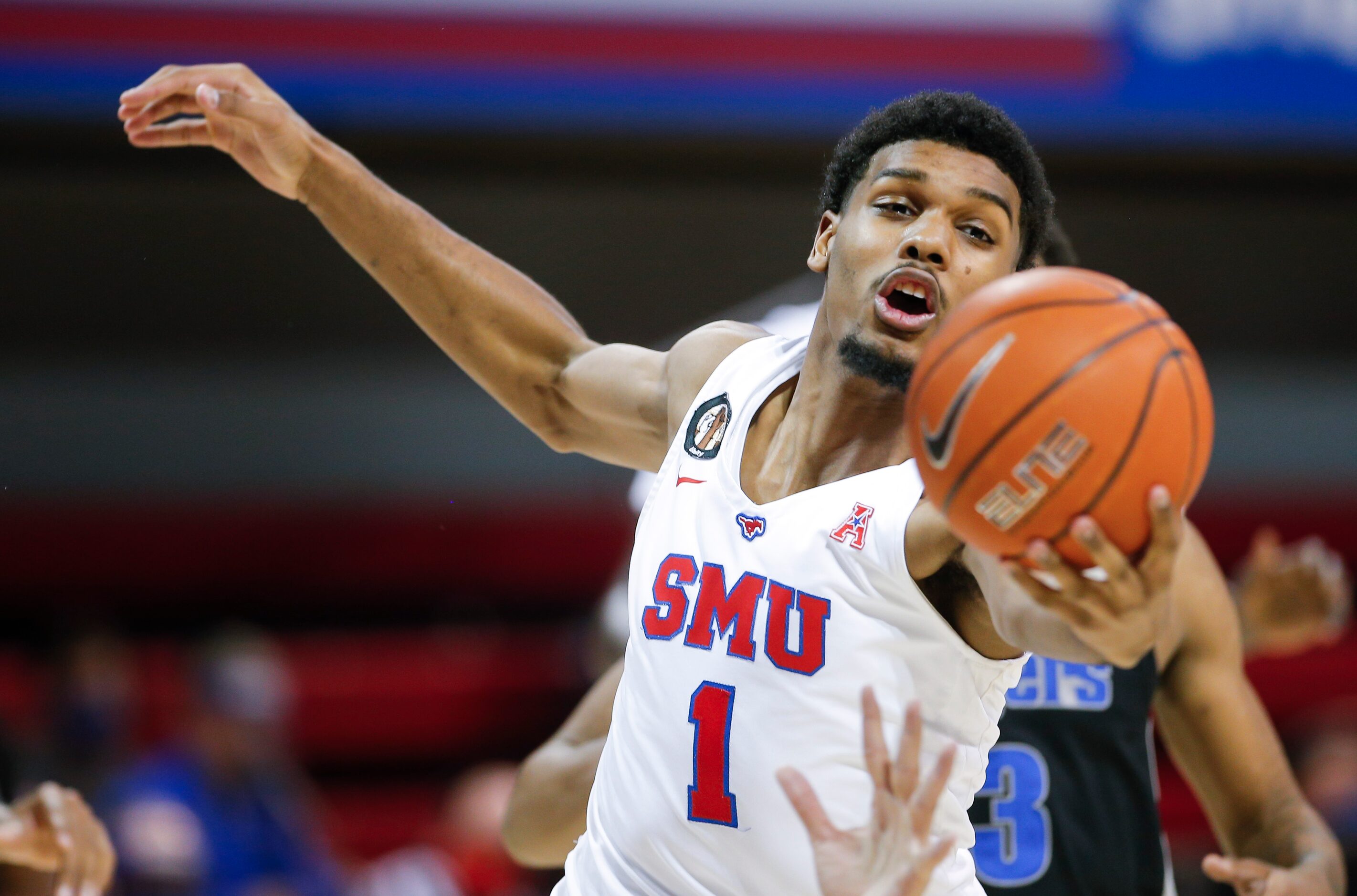 SMU forward Feron Hunt (1) reaches for a rebound during the second half of a college...