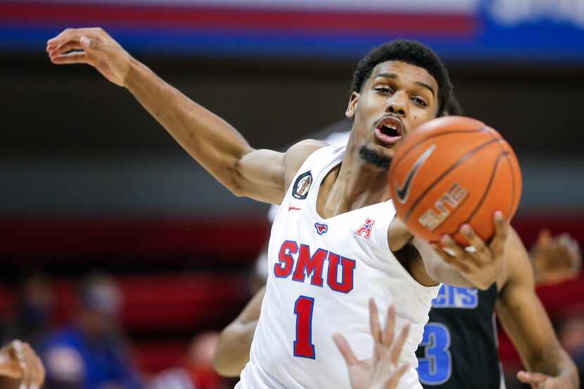 SMU forward Feron Hunt (1) reaches for a rebound during the second half of a college...
