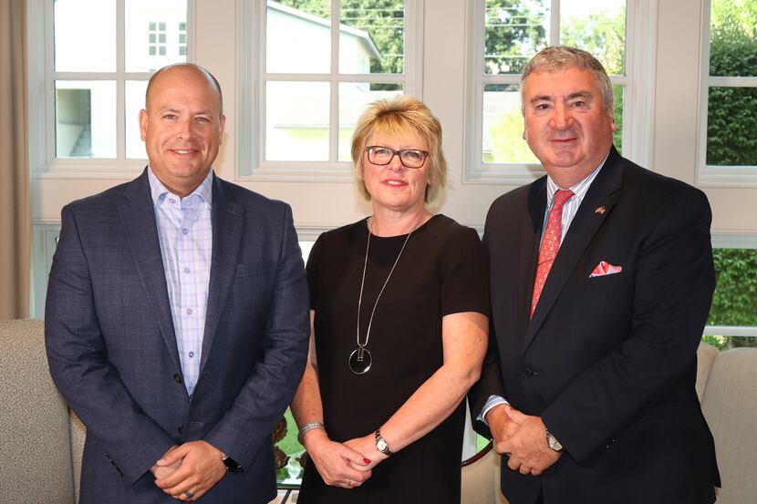 From left, Ebby Halliday Companies president and CEO Chris Kelly and Mayfair International...