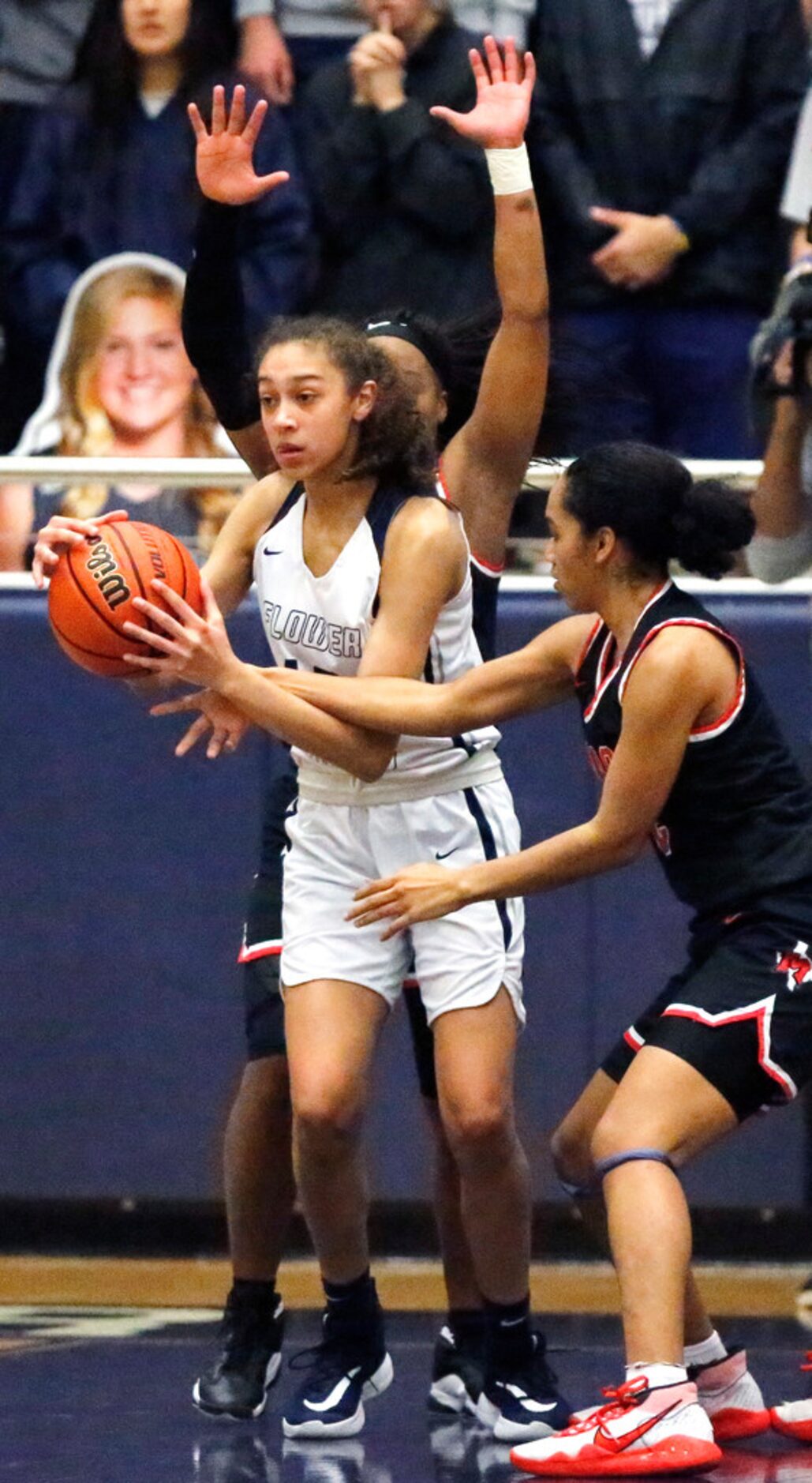 Flower Mound High School forward Sarah Edmondson (13) didnât get the foul call as she...