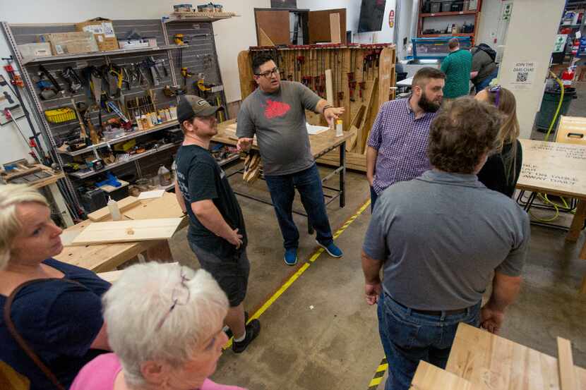 Alex Rhodes, a board member at the Dallas Makerspace, gives a tour of the woodworking area...