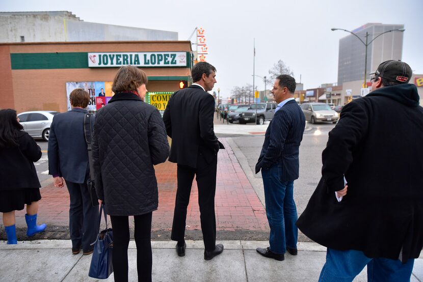 Democratic Senate candidate Beto O'Rourke (center) speaks with state Rep. Rafael Anchia...