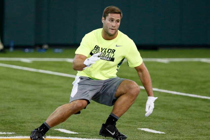 Bryce Hager sprints through a drills as he works out for scouts at Baylor NFL football Pro...