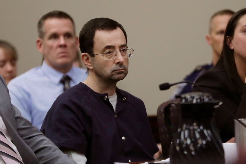 Larry Nassar listens during his January 2018 sentencing hearing  in Lansing, Mich. The...