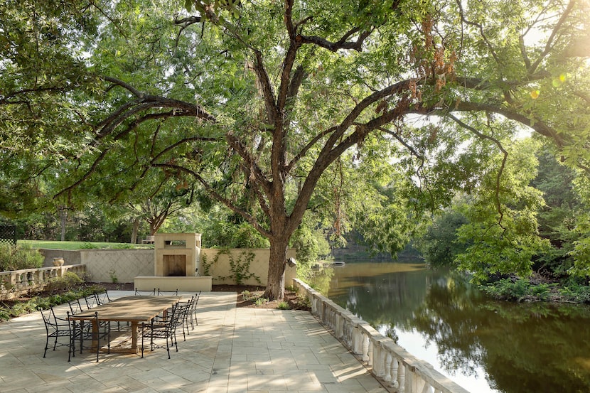 This spacious patio alongside Turtle Creek provides a shaded spot for entertaining.