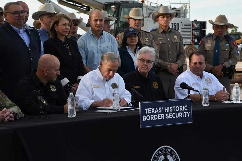 Texas Gov. Greg Abbott signed three bills into law at a border wall construction site in...