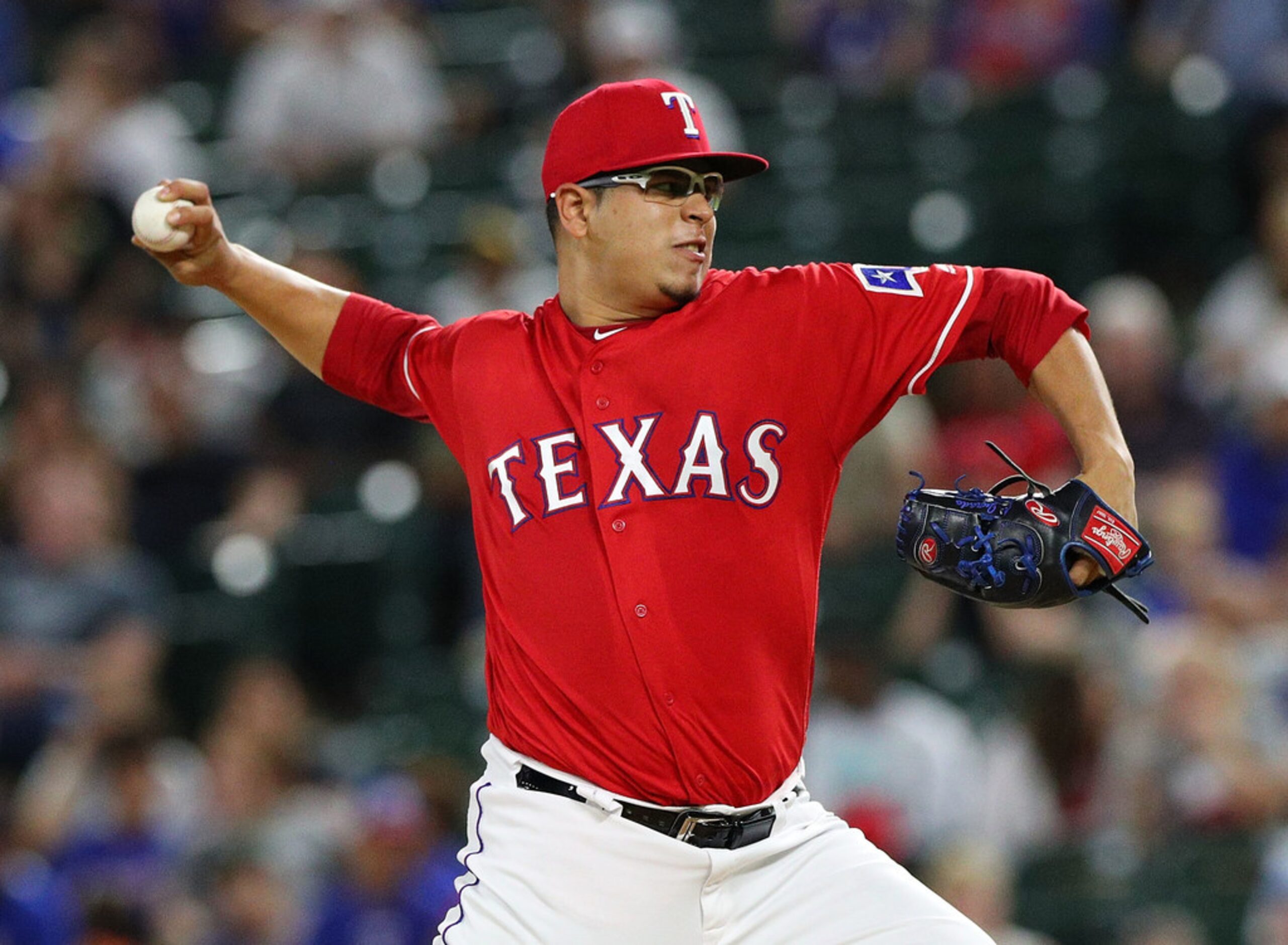 ARLINGTON, TX - SEPTEMBER 03:  Ariel Jurado #57 of the Texas Rangers pitches in the third...