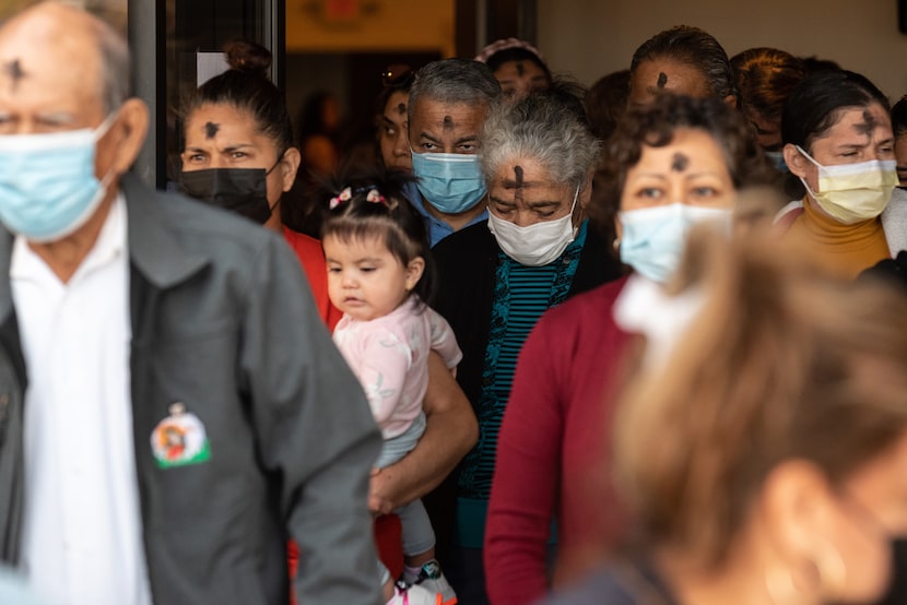 Parishioners leave San Juan Diego after the Mass. Father Daniel Rendón, a priest at San Juan...