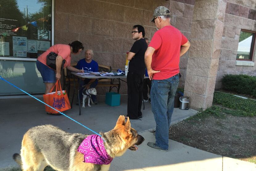 
Guests line up Saturday at the Richardson Animal Shelter for the Clear the Shelter pet...