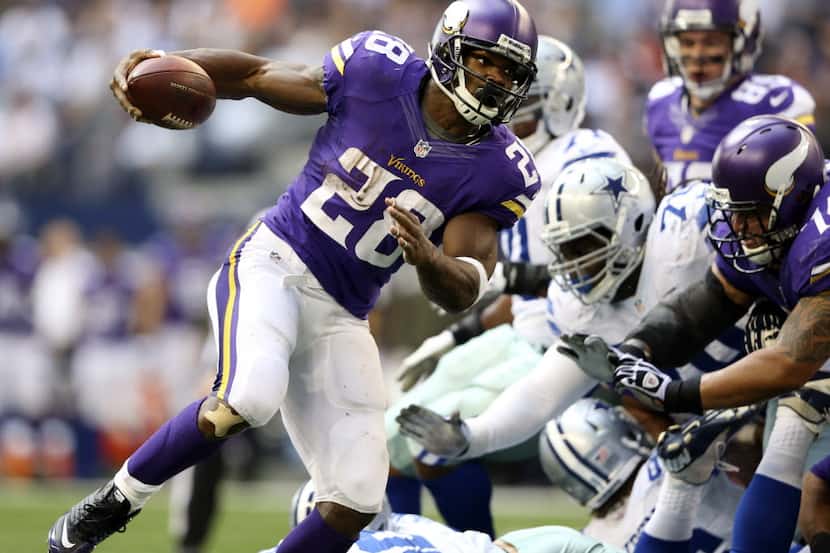 Minnesota Vikings running back Adrian Peterson (28) successfully runs the ball for a...