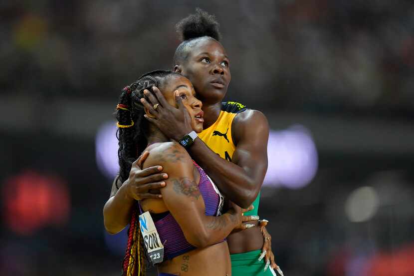Shericka Jackson, of Jamaica, right, embraces Sha'Carri Richardson, of the United States,...