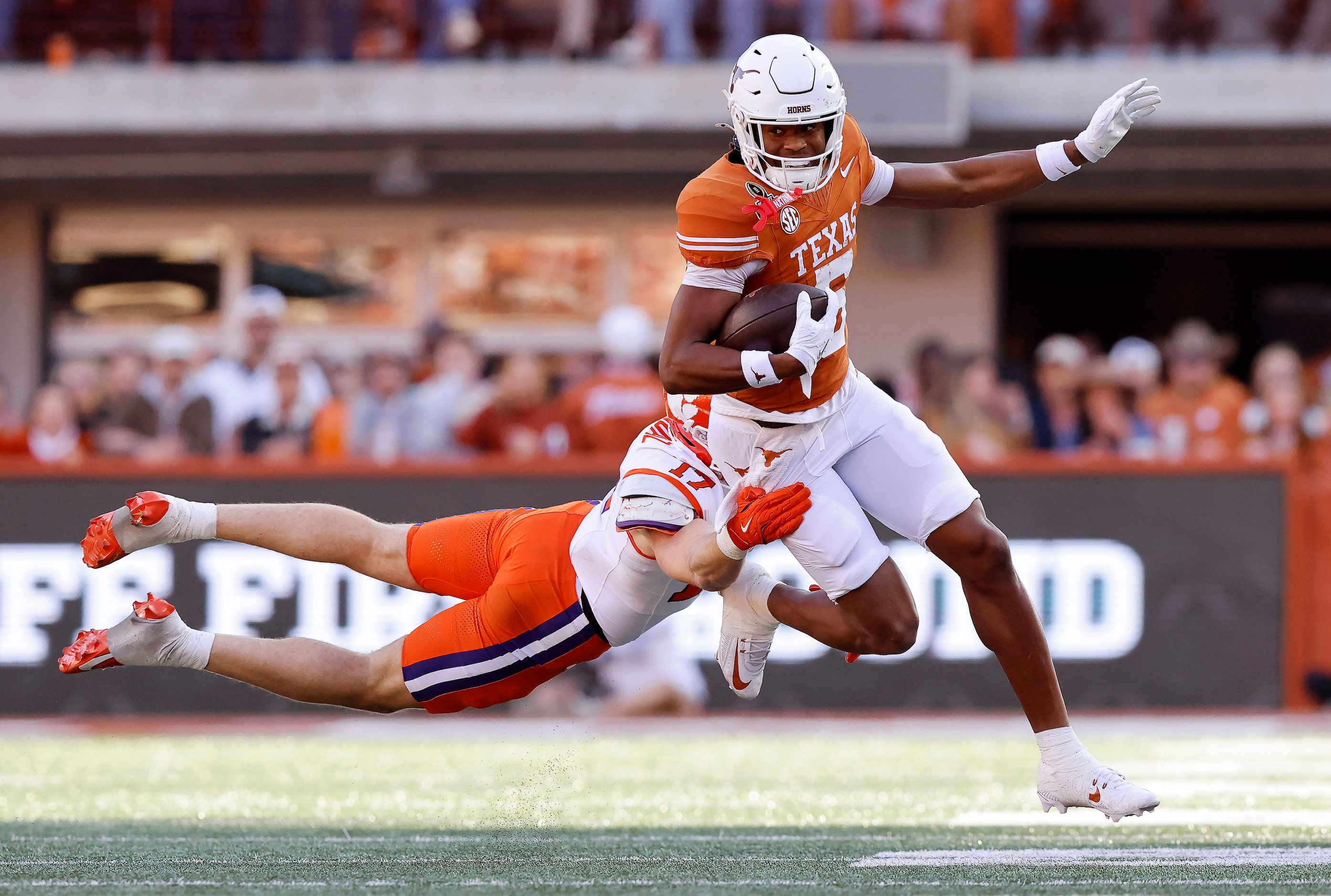 Clemson Tigers linebacker Wade Woodaz (17) makes a diving tackle attempt on Texas Longhorns...