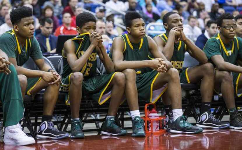 Madison reacts to a 68-60 loss to Bridgeport during their UIL Class 4A state semifinal boys...