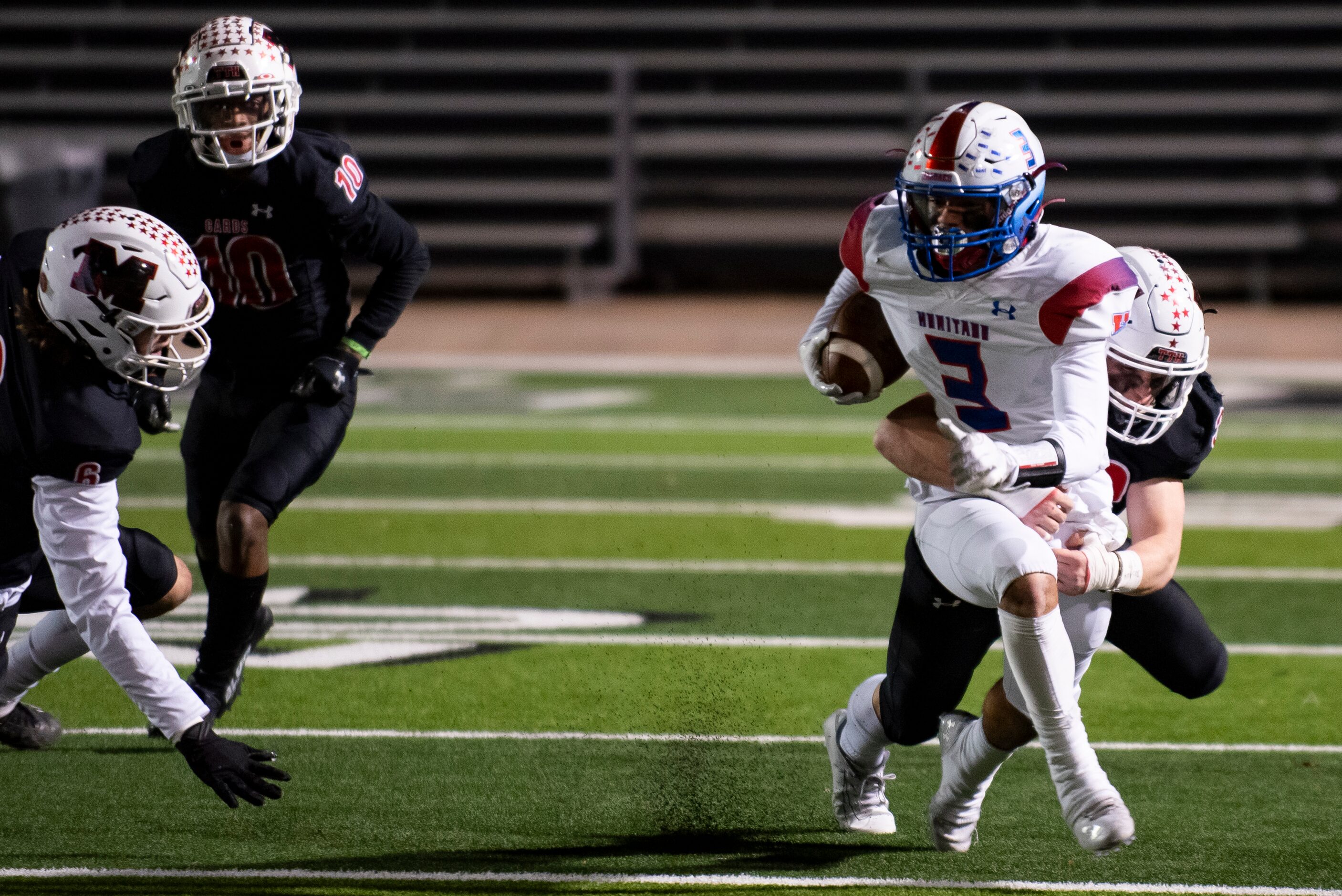 Midlothian Heritage junior Jason Barela (3) is tackled by Melissa junior Jayson Cave (33)...