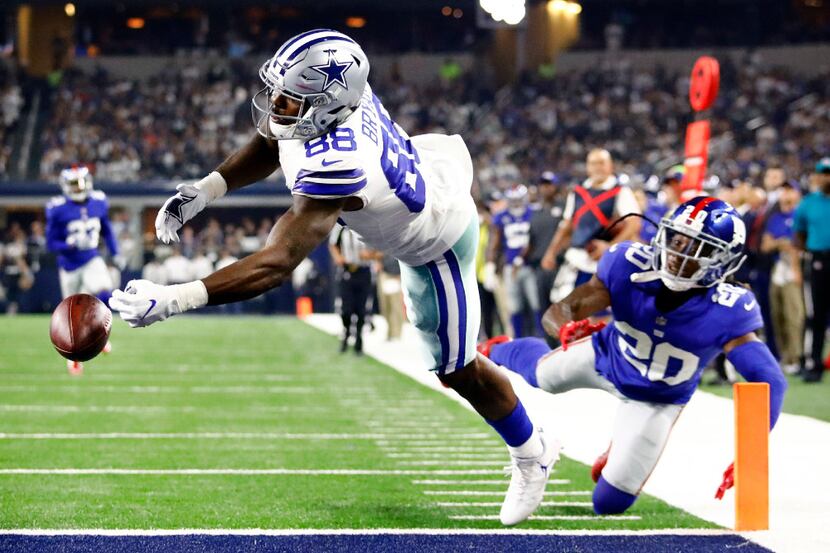 Dallas Cowboys wide receiver Dez Bryant (88) reaches for a pass that was a little short as...