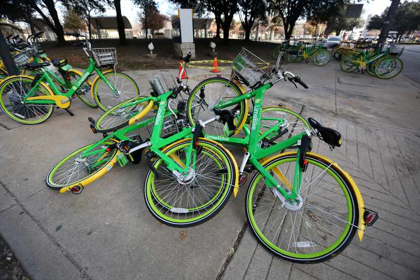Rental bikes were piled on the corner of Live Oak and Olive streets in downtown Dallas on...