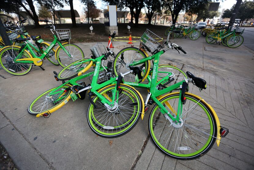 Rental bikes were piled on the corner of Live Oak and Olive streets in downtown Dallas on...