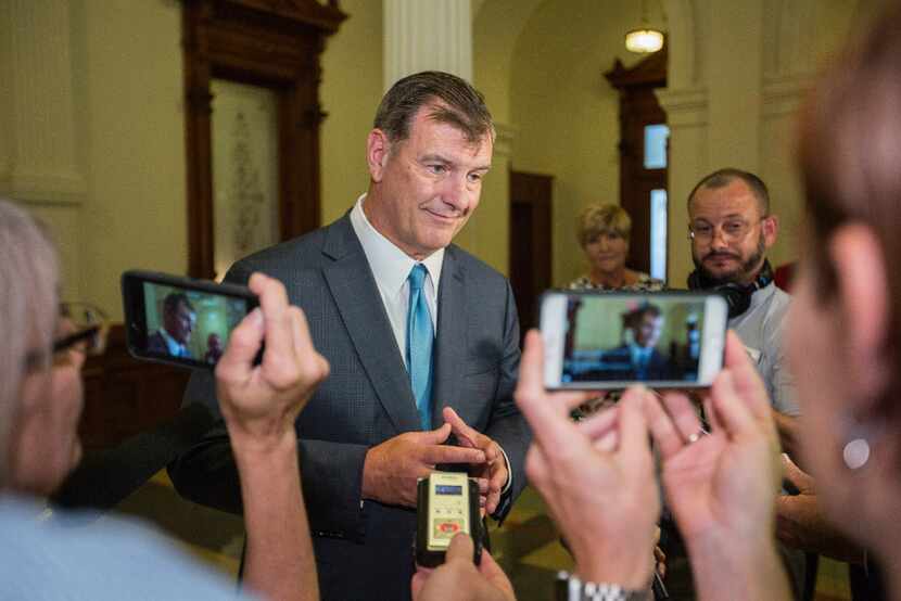 Dallas Mayor Mike Rawlings speaks with reporters after meeting with Gov. Greg Abbott to...