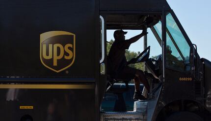 A United Parcel Service truck driver enters a company warehouse in Birmingham, Ala. (File...