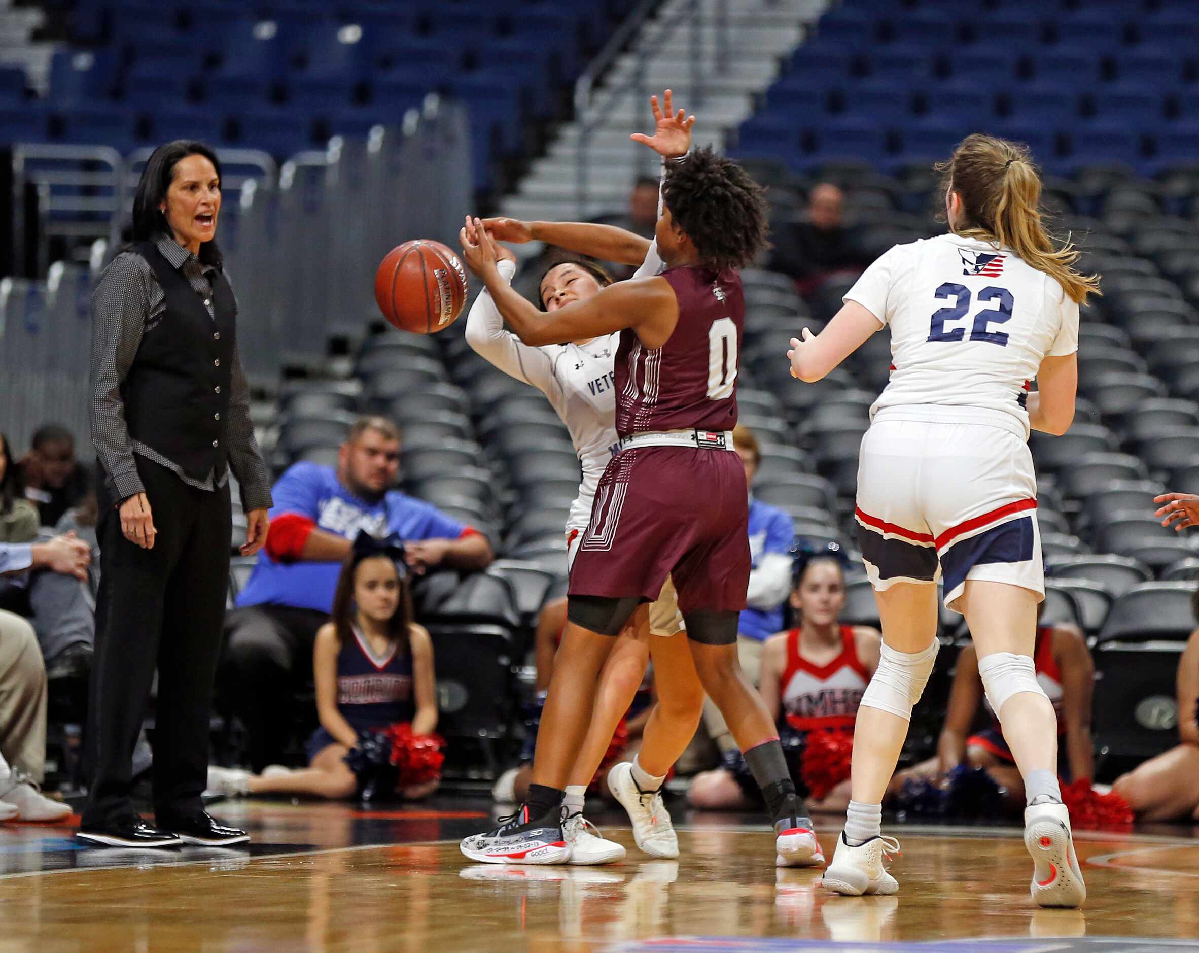 Mansfield Timberview guard Desiree Wooten #0 tries to steal the ball from Veterans Memorial...