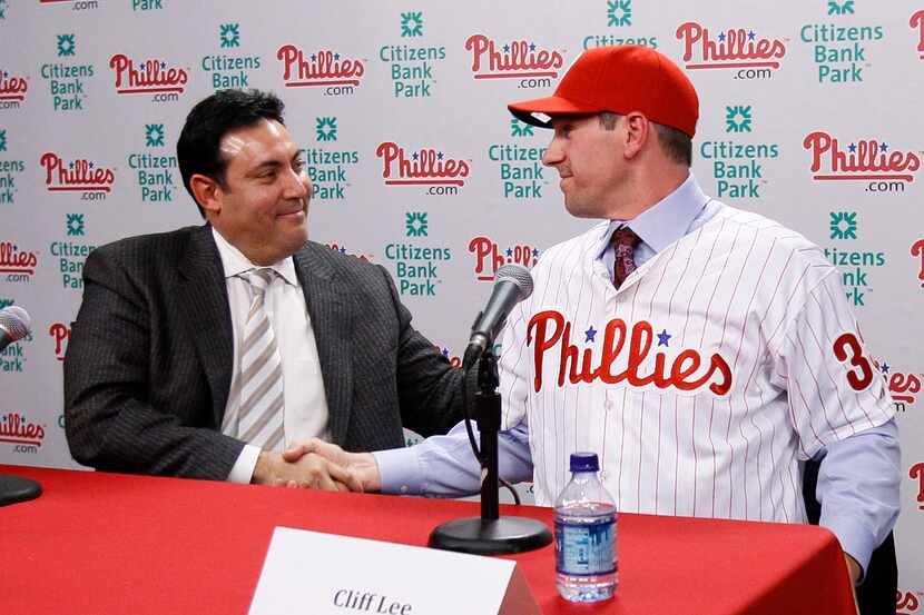 ORG XMIT: PXS107 Philadelphia Phillies general manager Ruben Amaro Jr., left, and pitcher...