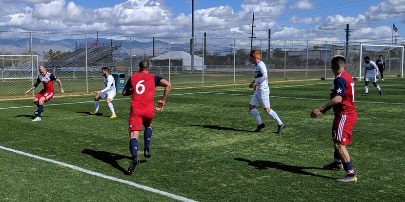 Ondrasek readies to hold off a defender as Pedroso and Aranguiz of FC Dallas look on against...