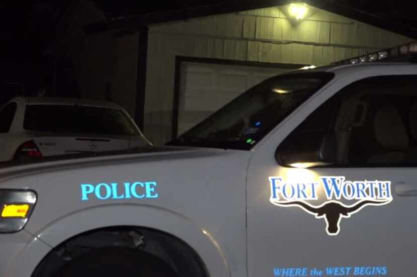 A Fort Worth police vehicle sits outside a home where a man was fatally shot Tuesday night.