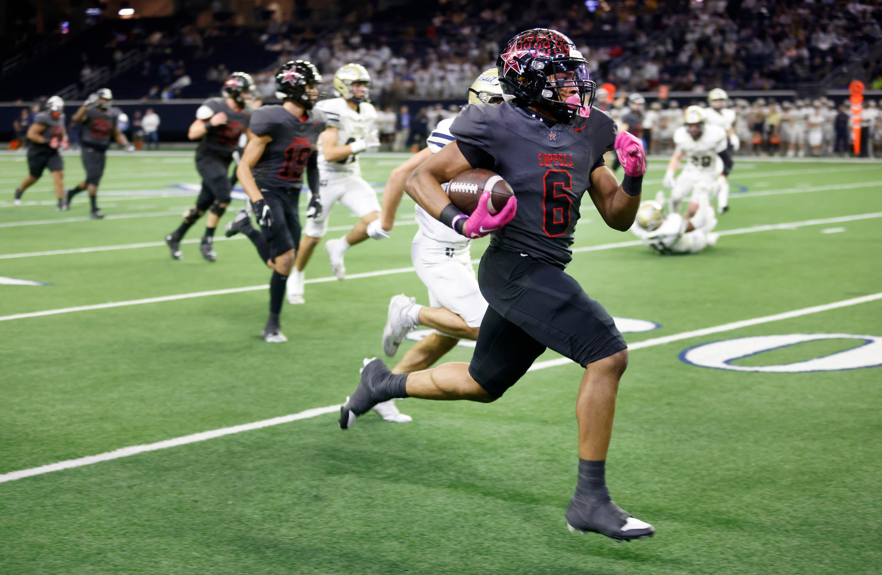 Coppell running back O’Marion Mbakwe (6) breaks away for a fourth quarter touchdown against...