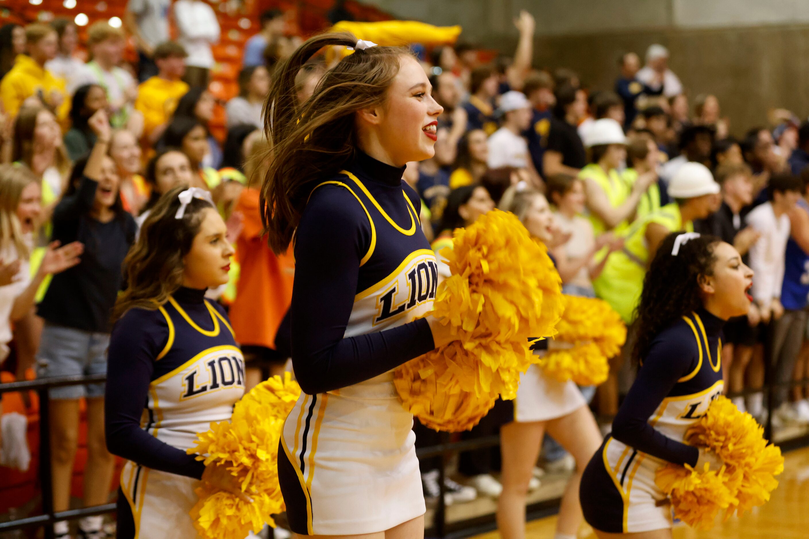 McKinney cheerleaders jump with excitment during the second half of the Class 6A Region I...