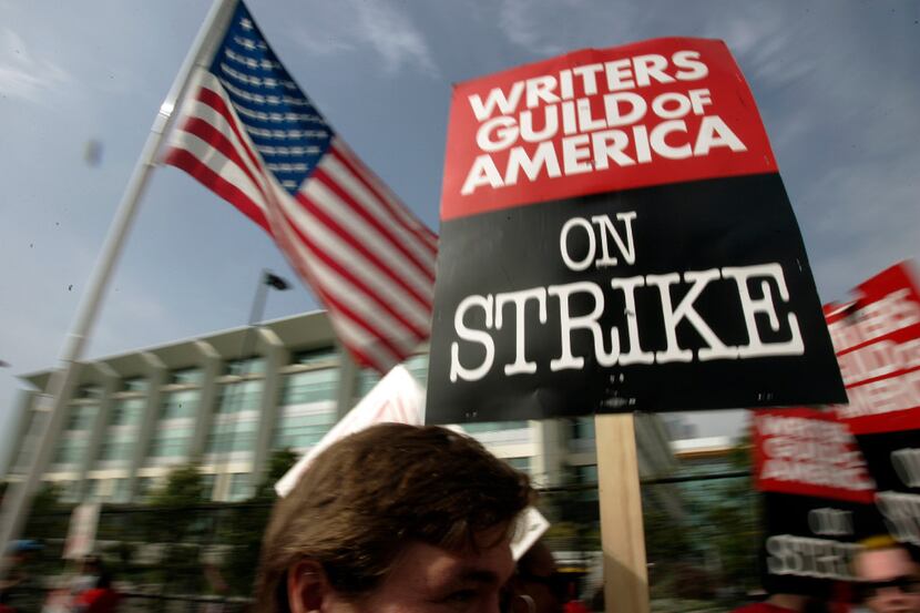 FILE - In this Nov. 9, 2007 file photo, Writers Guild of America (WGA) writers and others...