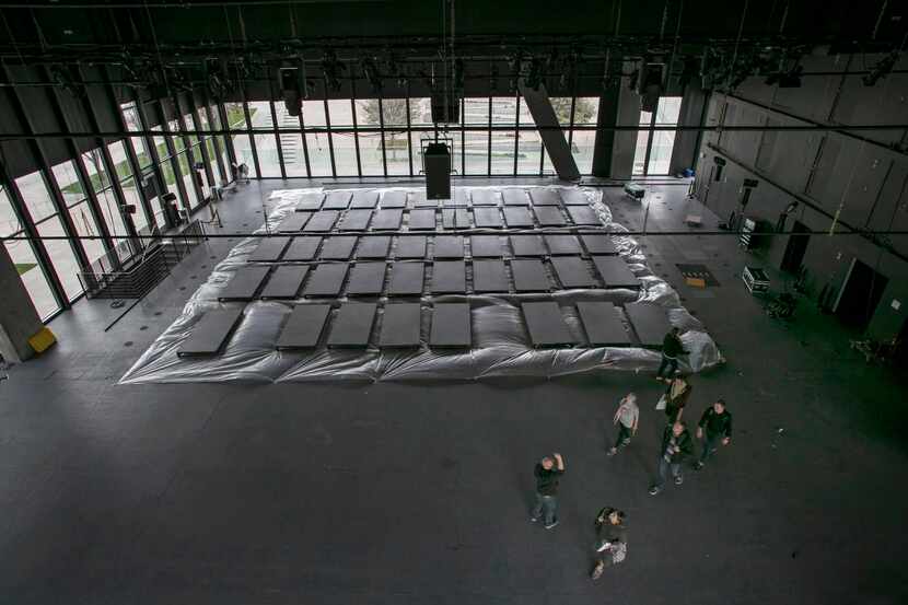 
Riser panels are arranged on the floor for painting prior to the construction of an indoor...