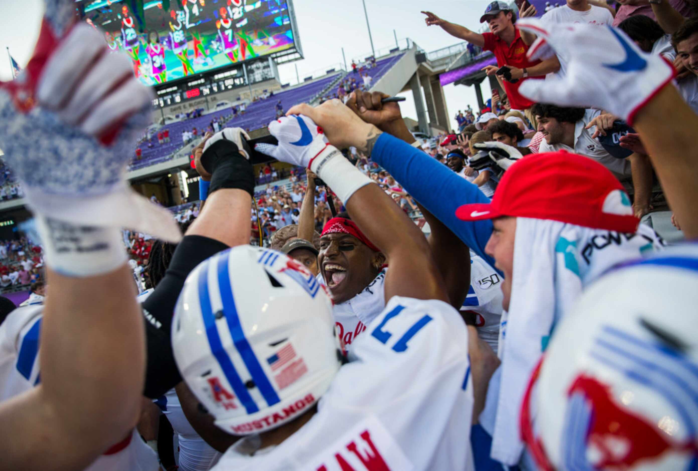 Southern Methodist Mustangs celebrate a 41-38 win over TCU Horned Frogs by hoisting the...