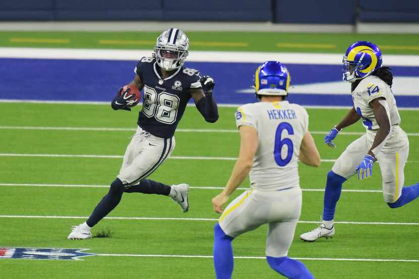 CeeDee Lamb #88 of the Dallas Cowboys returns a punt during the third quarter against the...