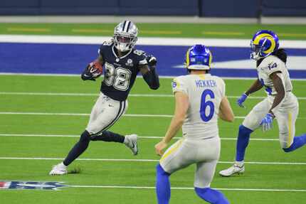 Cowboys wide receiver CeeDee Lamb (88) returns a punt during the third quarter against the...