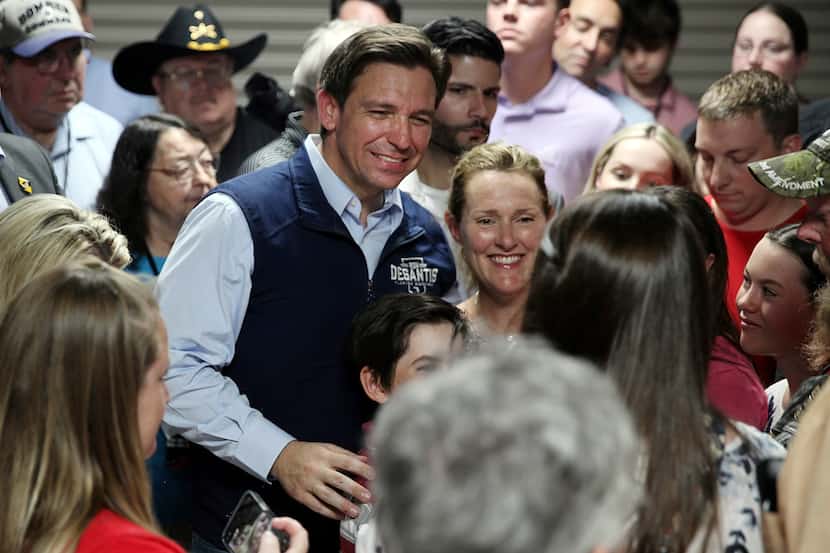 Florida Gov. Ron DeSantis posed for a picture with voters after a speech in Council Bluffs,...