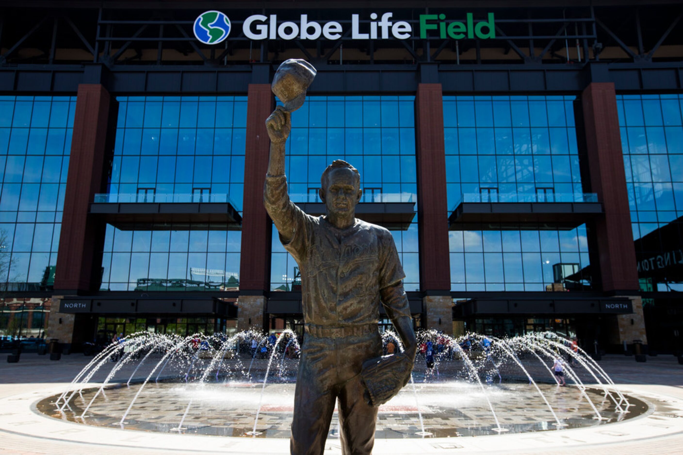 A statue of MLB Hall of Famer Nolan Ryan stands outside Globe Life Field during an open...