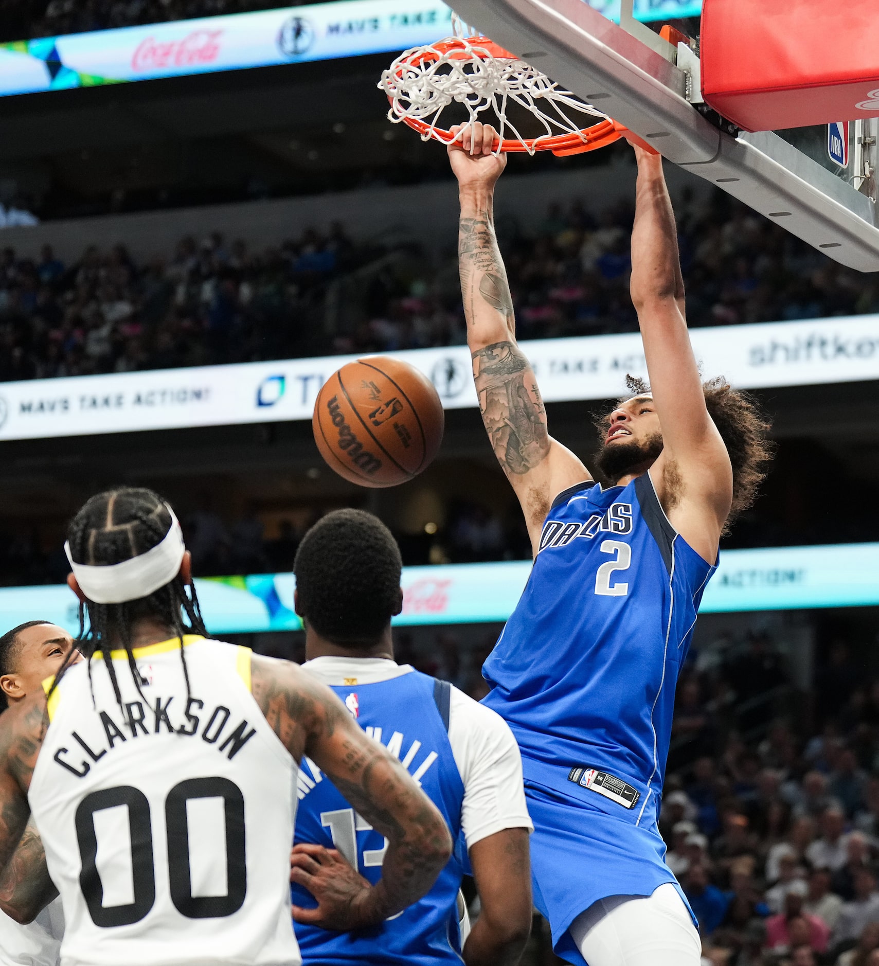 Dallas Mavericks center Dereck Lively II (2) dunks the ball during the first half of an NBA...