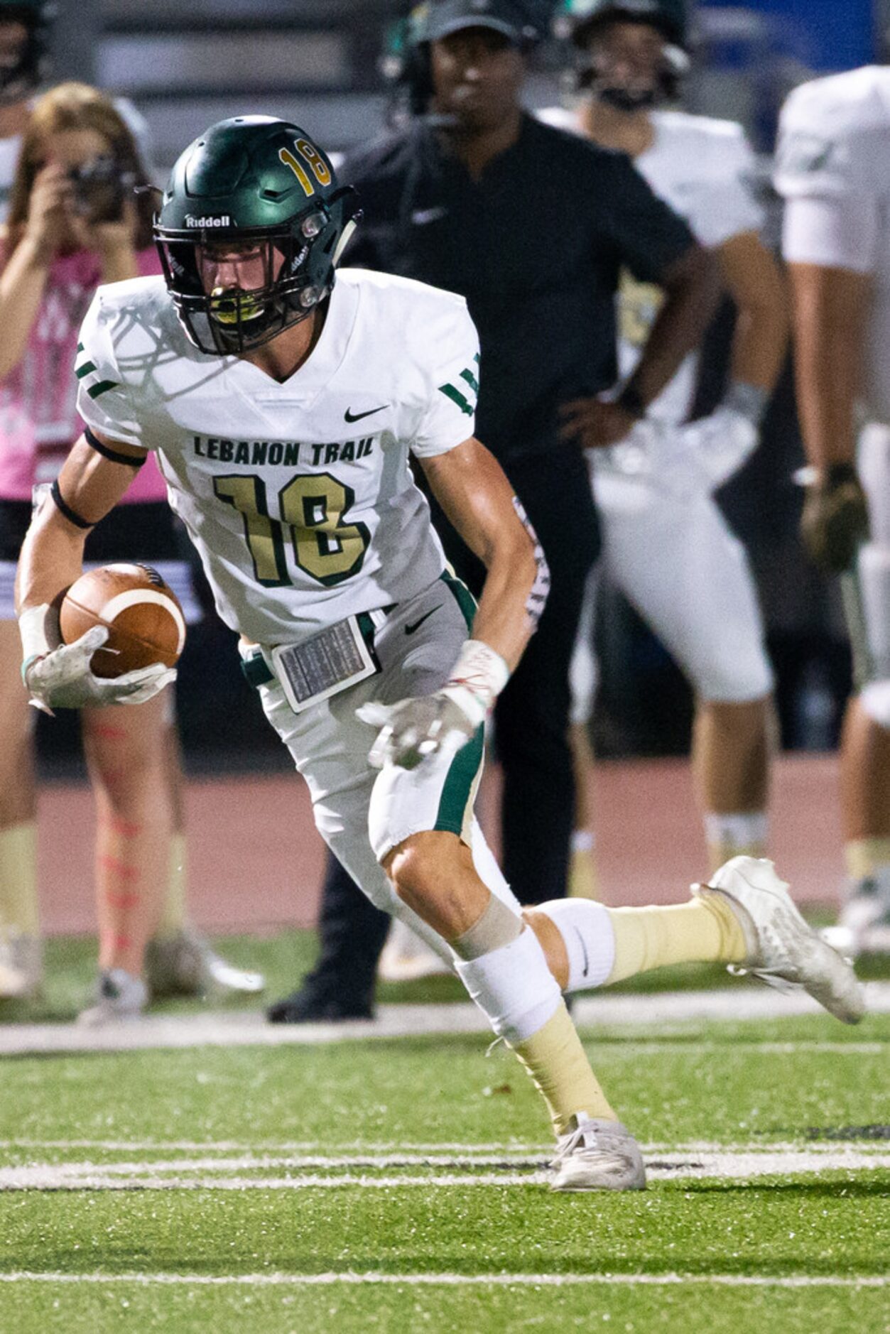 Lebanon Trail wide receiver Drew Donley (18) runs a pass during the football game between...